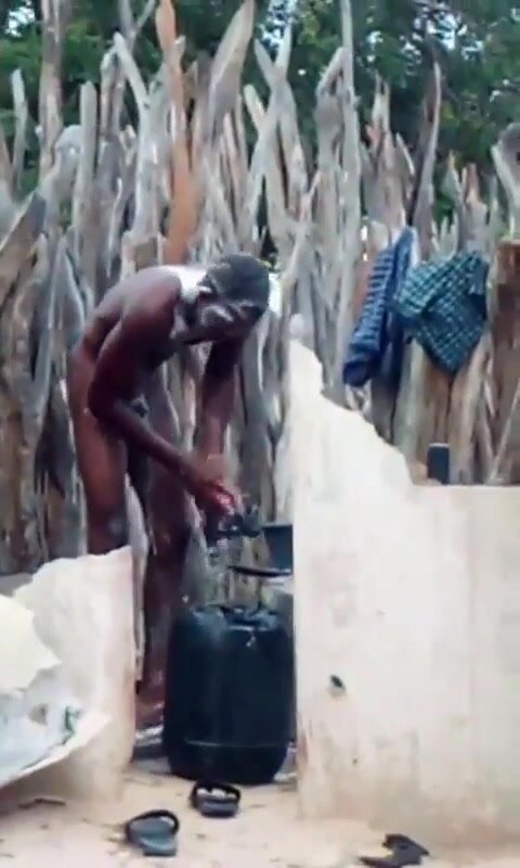hung african dude caught bathing naked outdoors