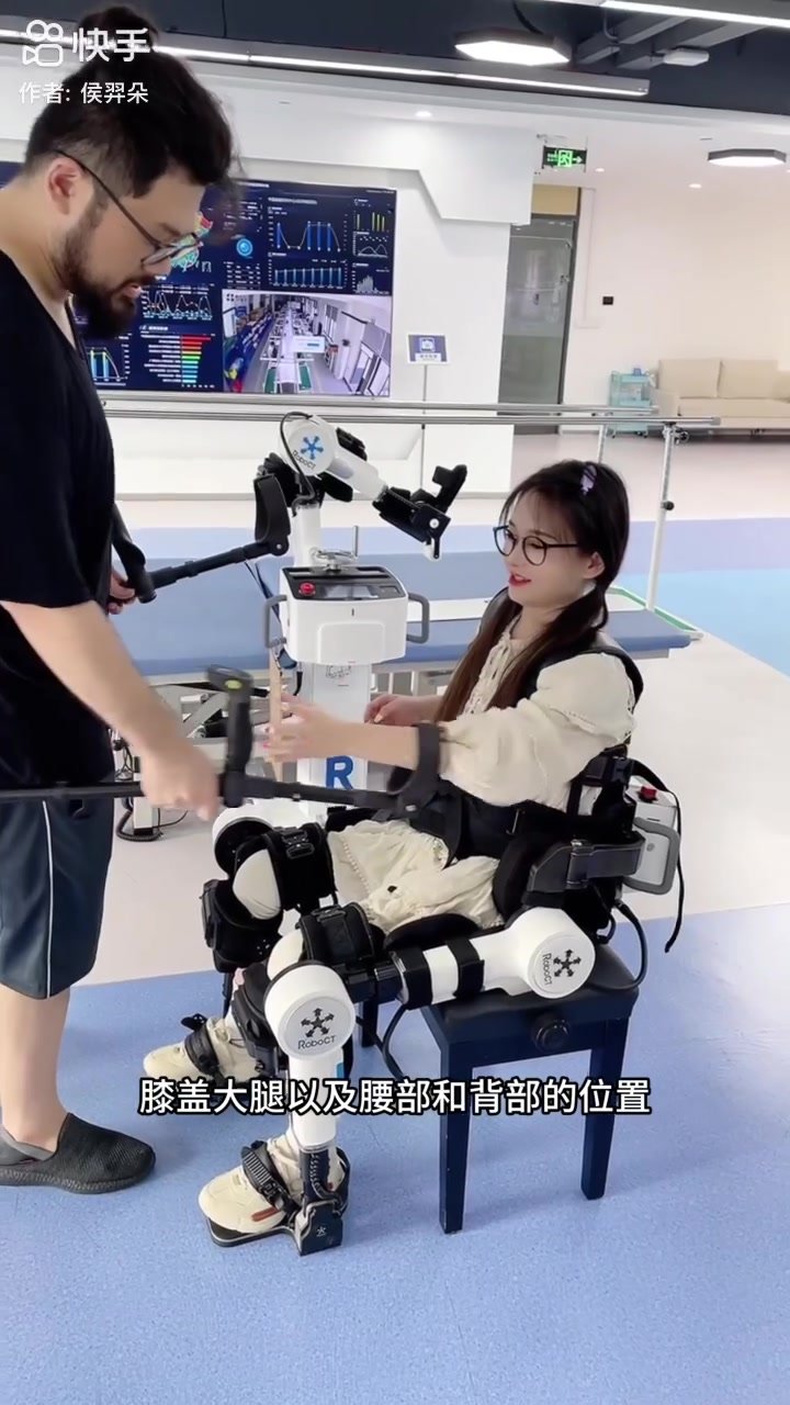Cute paraplegic girl trying exoskeleton to walk