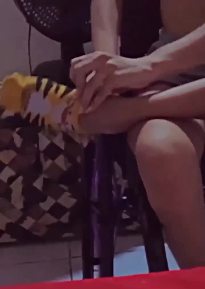 beautiful paraplegic girl putting socks on her feet
