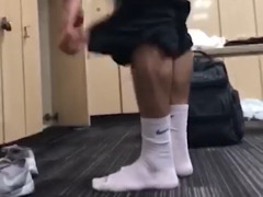 handsome guy in white sweaty socks in the locker room