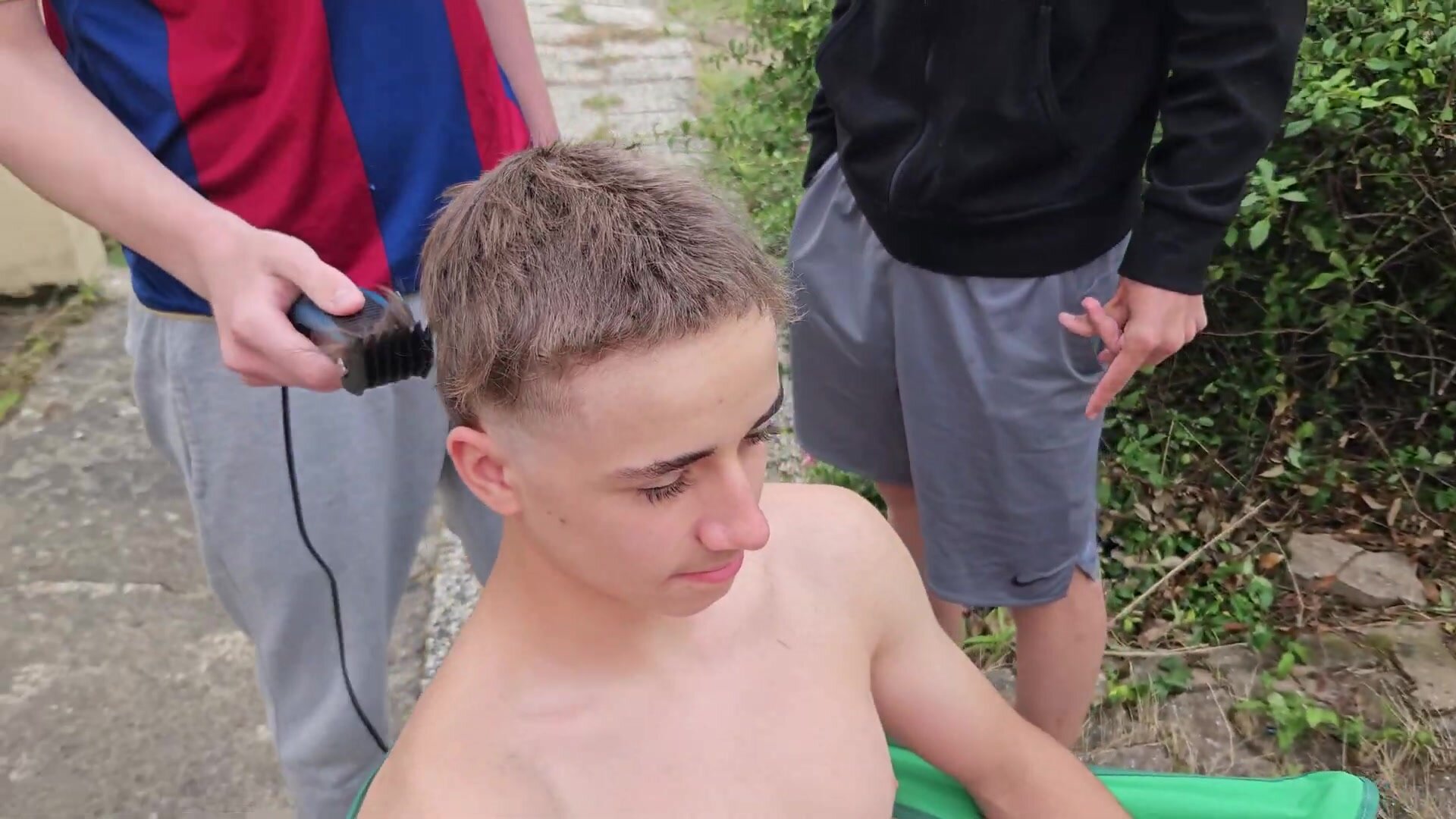 French teen gets shirtless backyard haircut