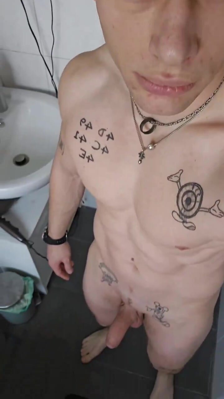 tattoed guy show off before shower