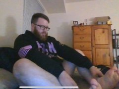 Ginger Bear plays with feet