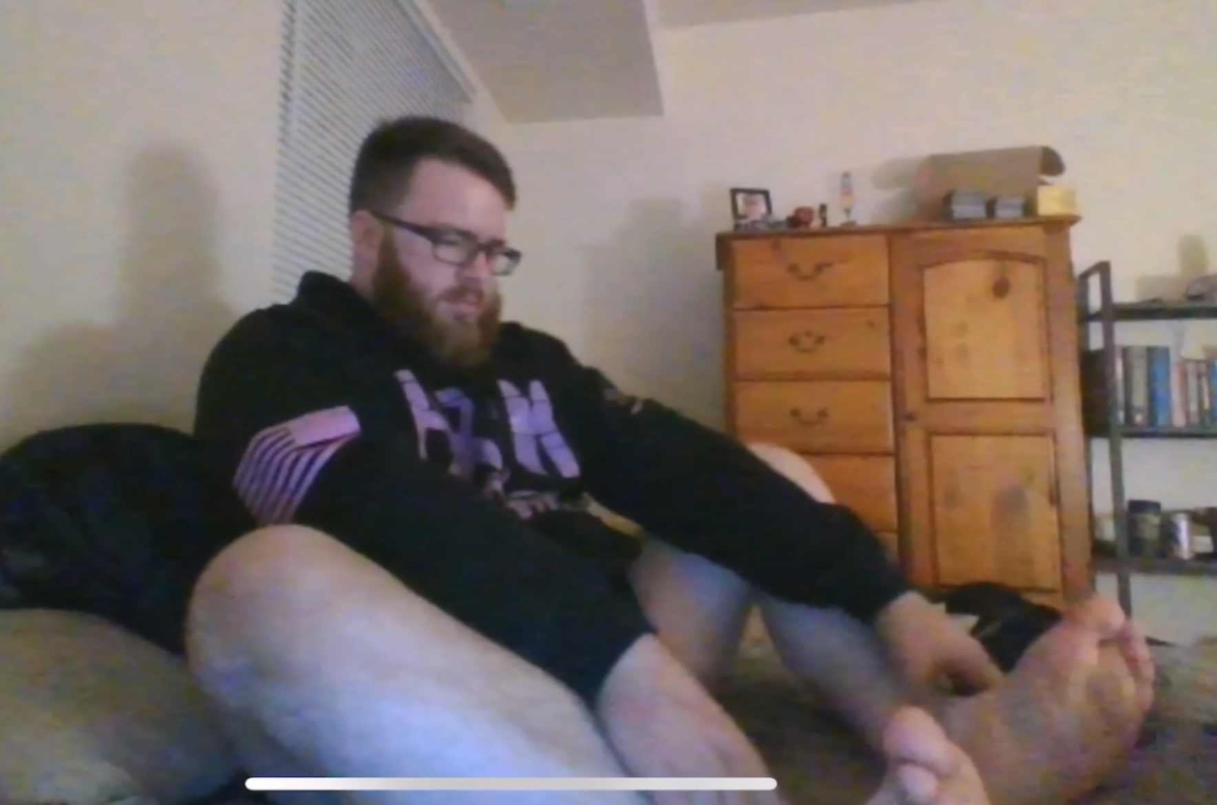 Ginger Bear plays with feet