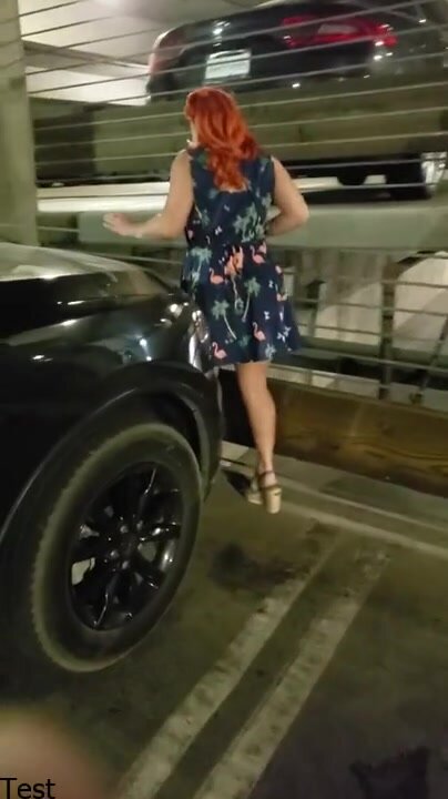 Girl pissing in a car park