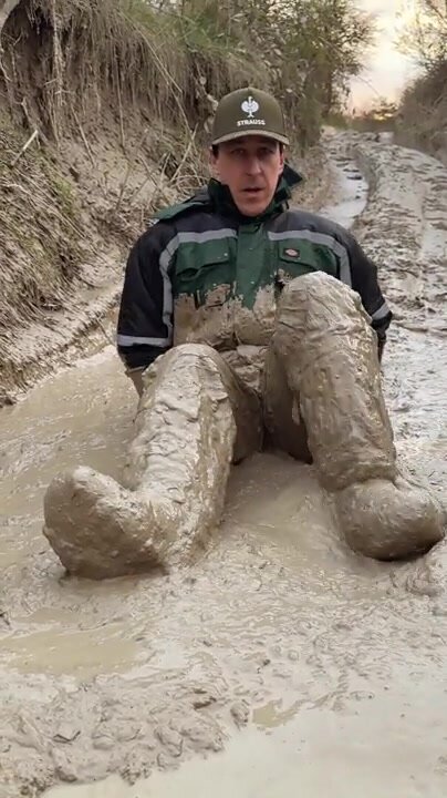 in workgear in the mud