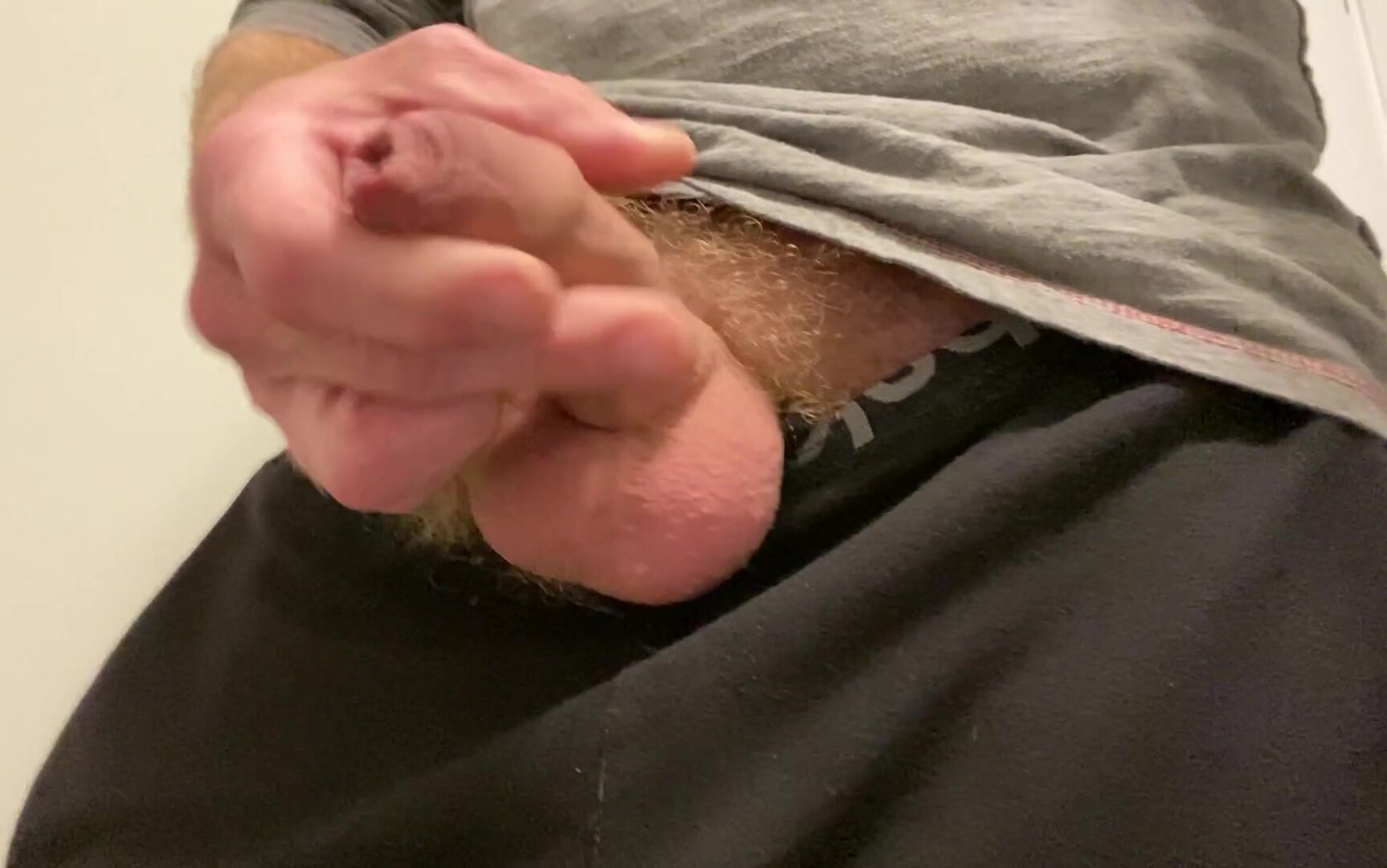 furry ginger aussie bloke pulls cock out of trackies