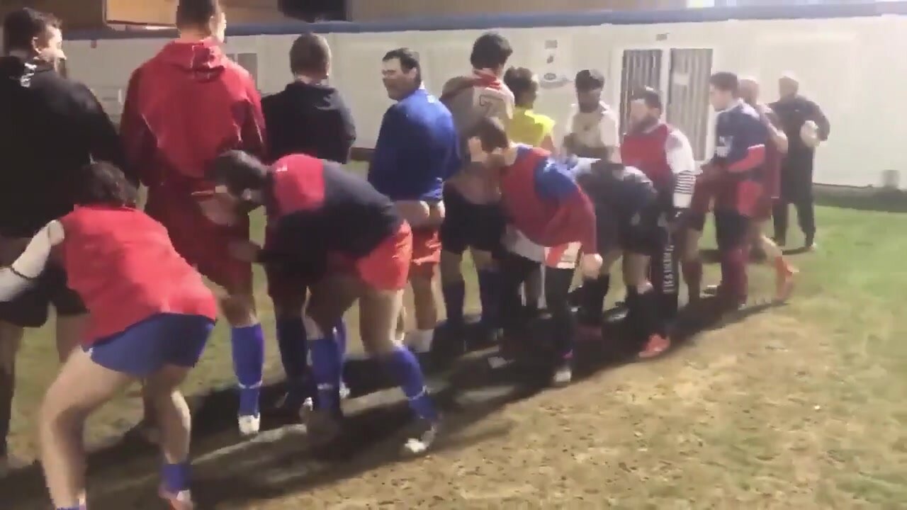 Straight rugby players kissing ass of the winning team