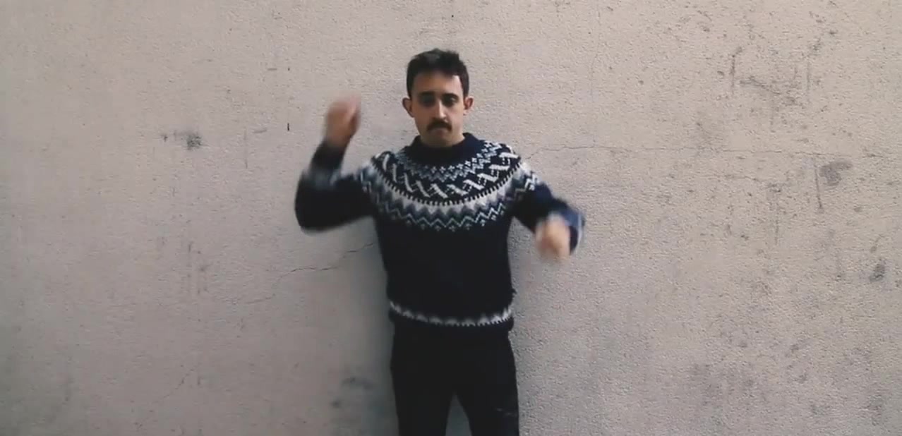 Man take off his alpaca sweater