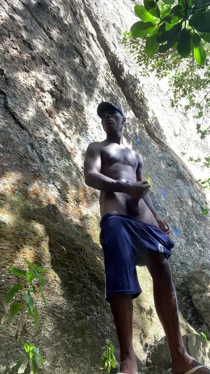 Black Brazilian shooting his load outdoors
