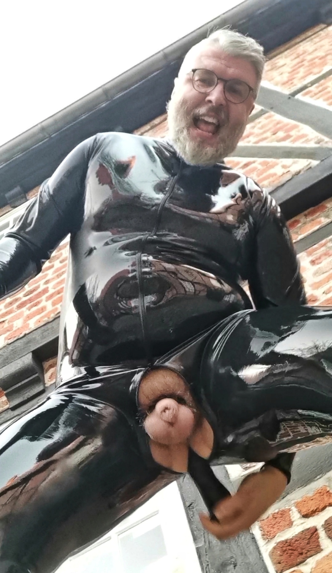 Public dildo ass fuck in full rubber catsuit