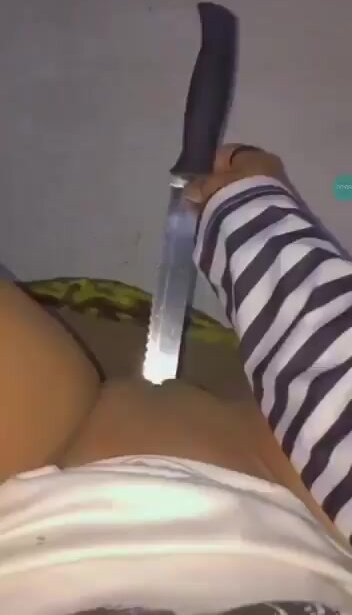 girl masturbating with a knife