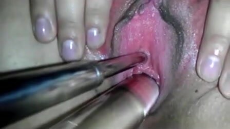 Sounding her peehole and rubbing her clit