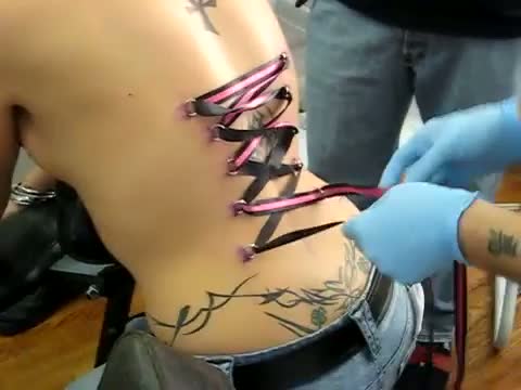 Brutal piercing with laces on the back