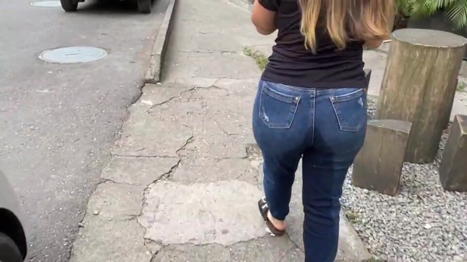 She pees in her jeans on the street in public
