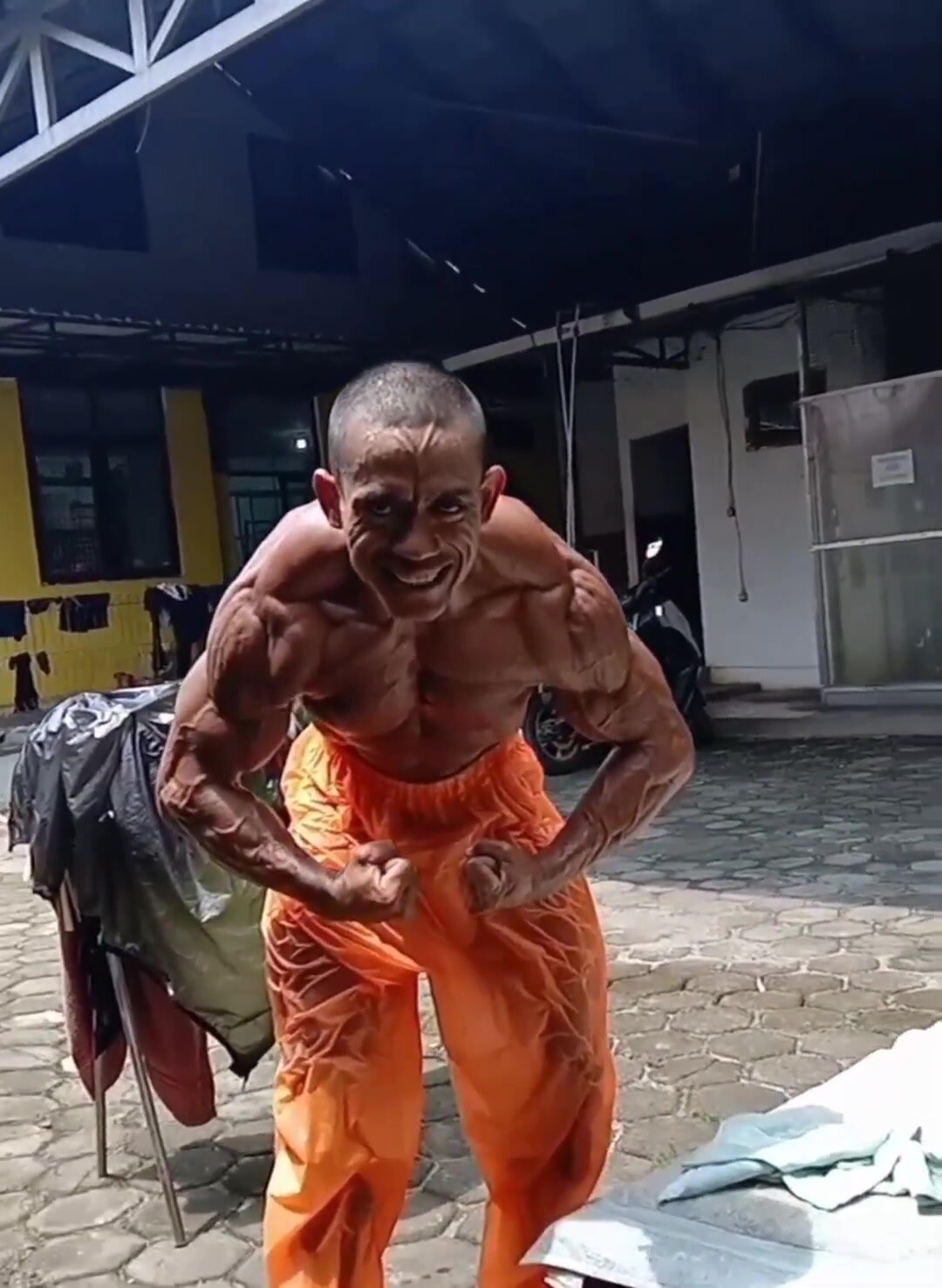 Indonesian bodybuilder sunbathing