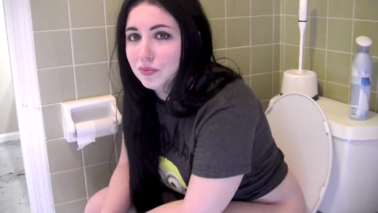 young brunette shitting