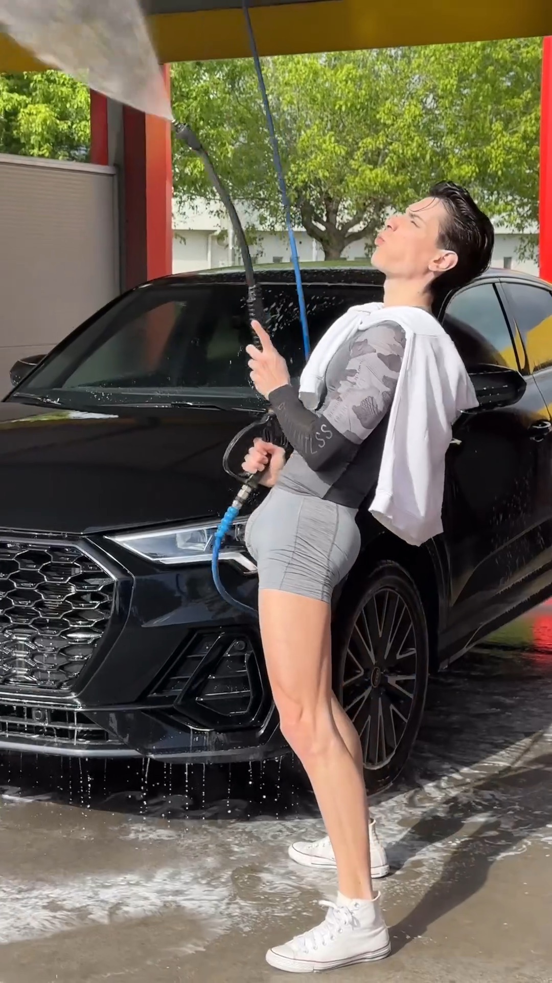 Slut with a tight ass and massive bulge washing his car
