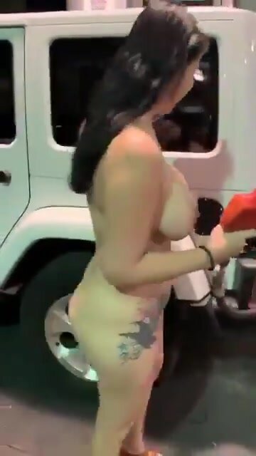 Sexy Asian American pumps gas completely naked