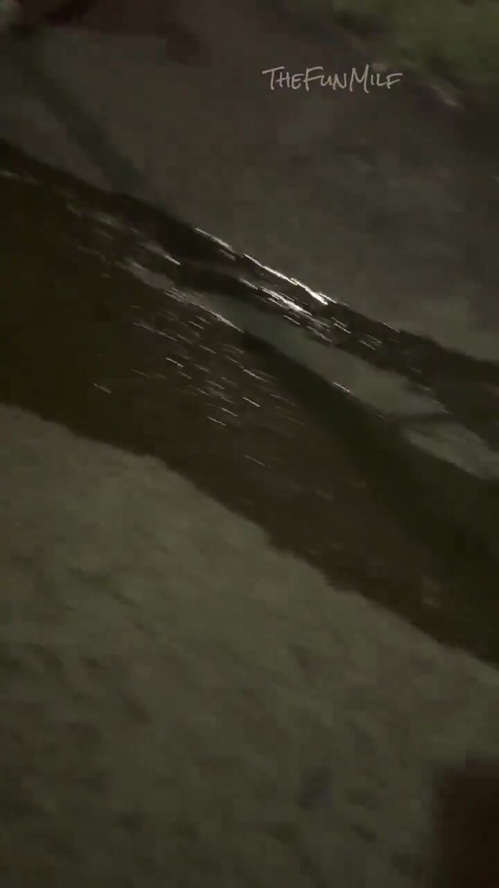 Fun milf creates a flowing puddIe outside at night