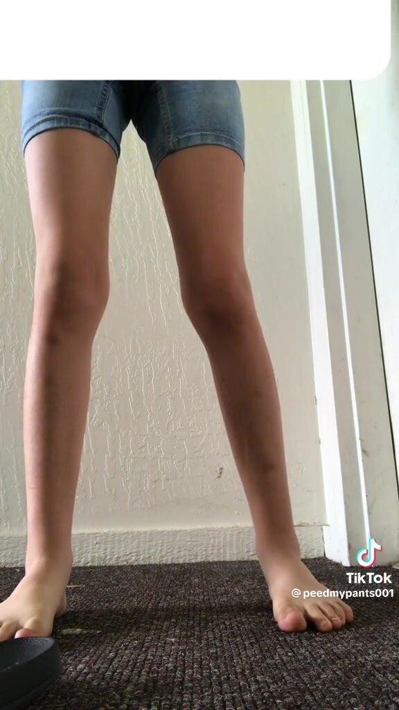 cute girl pees jean shorts