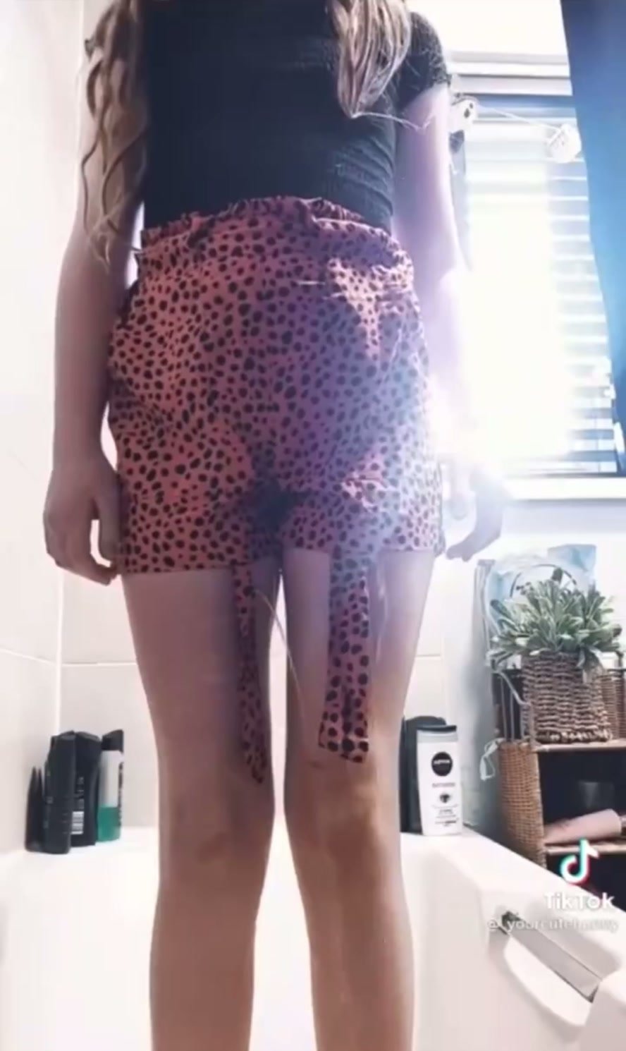 girl pees leopard shorts
