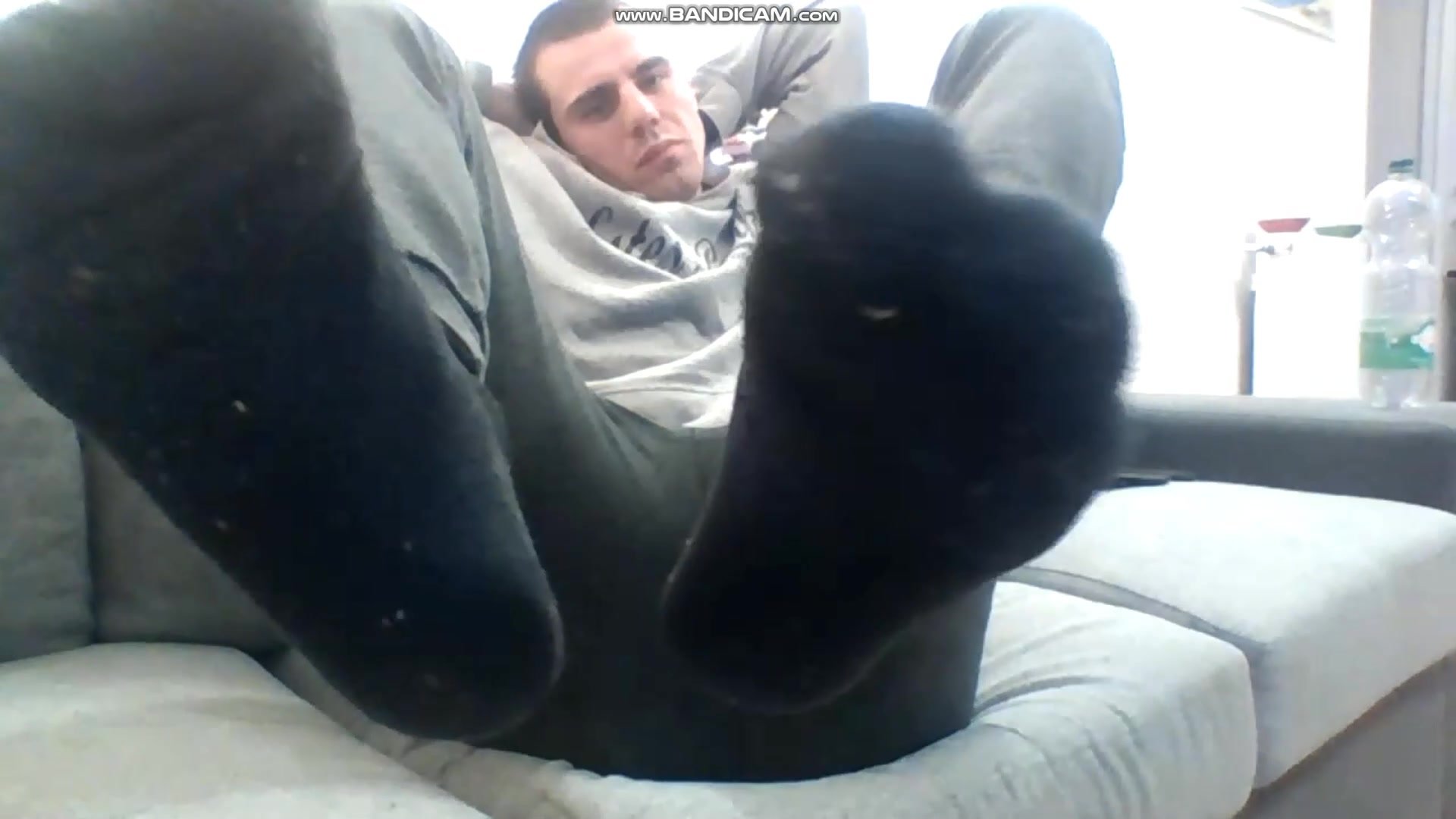 Young stud shows black socks and feet
