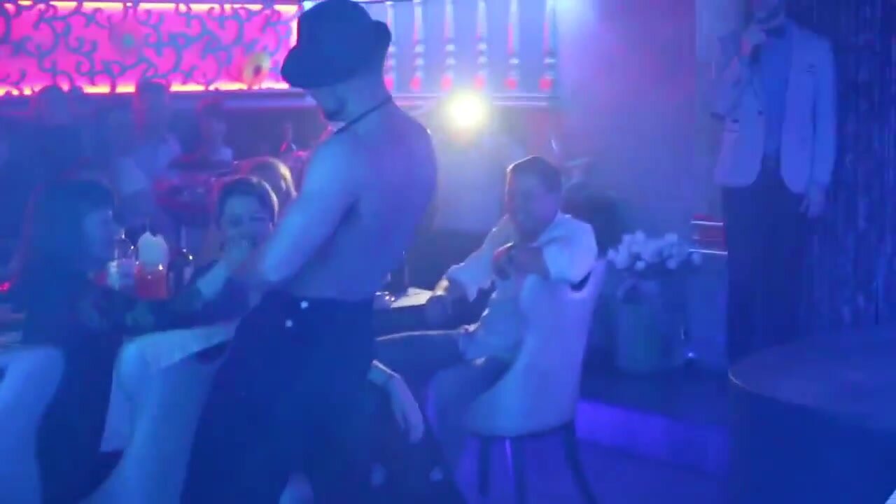 Male striptease in nightclub