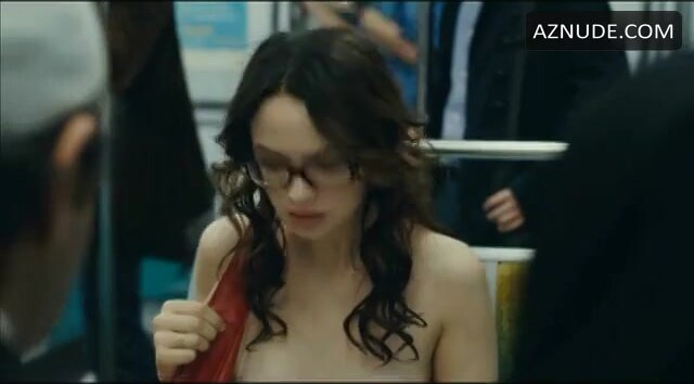 Woman rides the subway naked