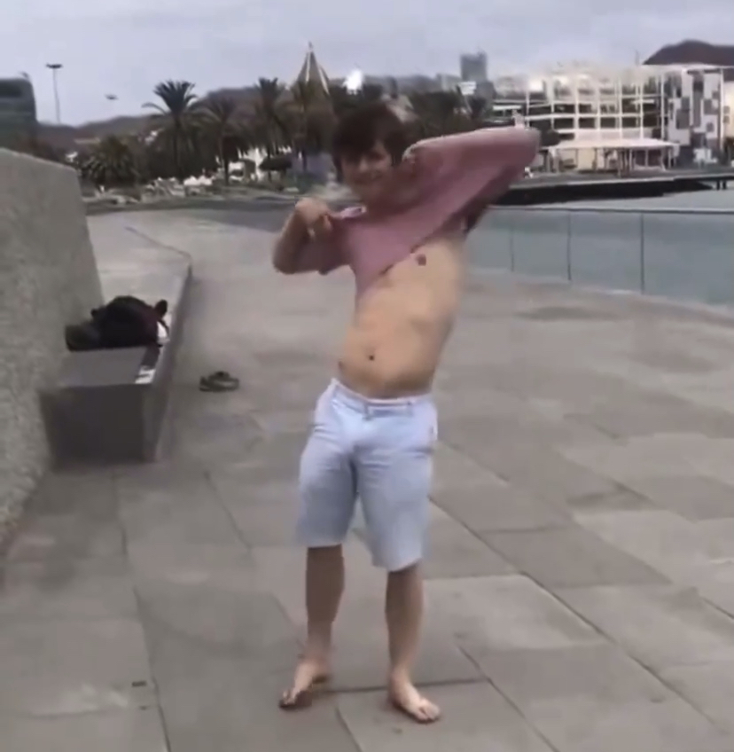 Twink strips naked and backflips in public