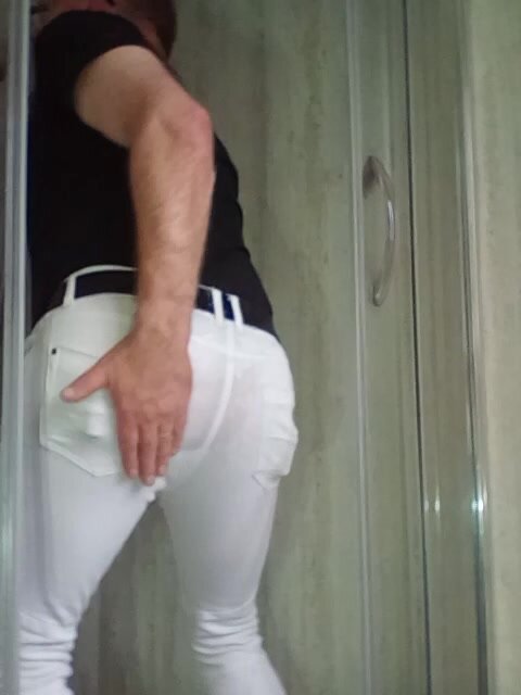 Shower in white tight jeans