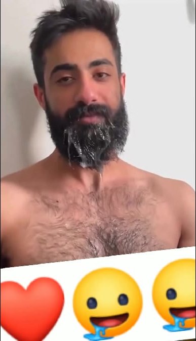 Happy Handsome guy with a beard full of sperm