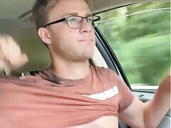 Hot blond glasses guy out driving and jerking off.