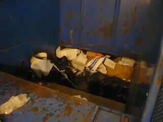 Stroller in trash compactor