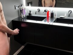 Horny twink shoots a big load in the bathroom
