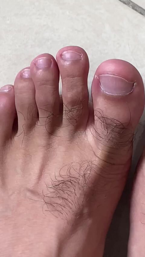 Nice hairy feet toes close up I