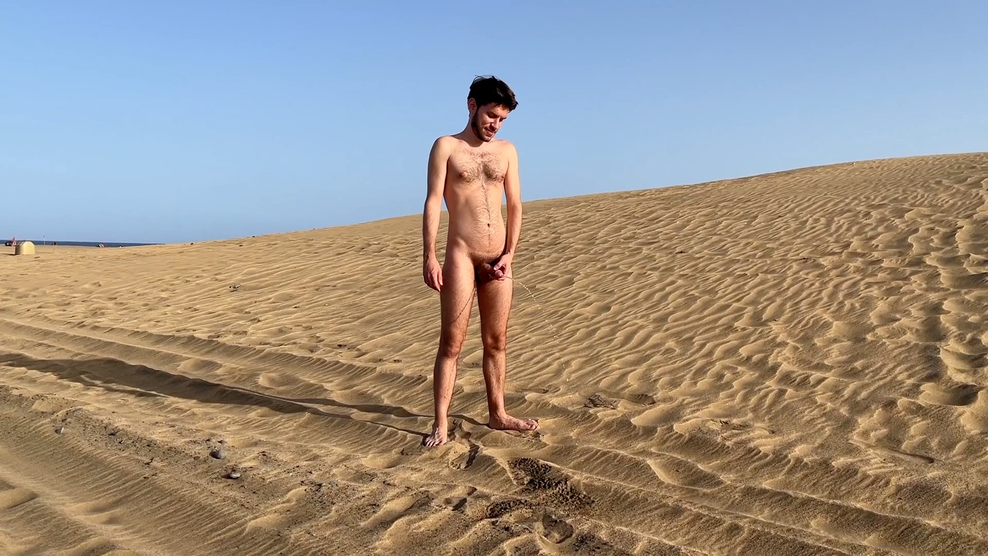Gay nudist peeing on the nude beach
