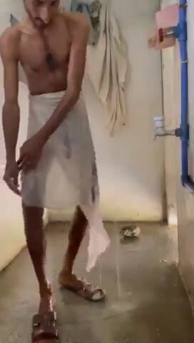 hairy skinny paki shows huge cock while through towel