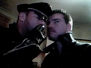 Leather Daddy and boy smoking