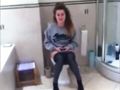 Girl films friend on the toilet they both laugh
