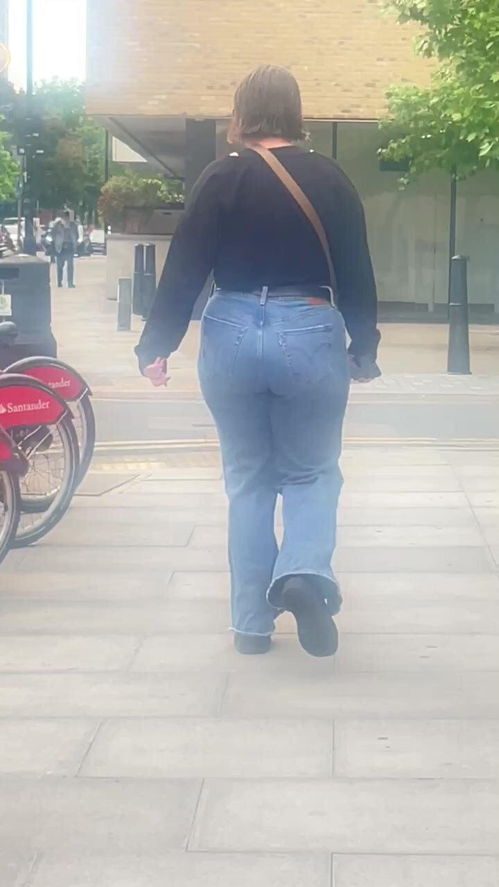 Juicy brunette walking in tight jeans