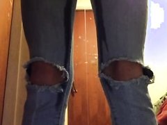 girl pees knee-cut jeans