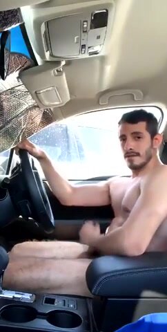 Hot and horny uncut guy jerks off in his car in public
