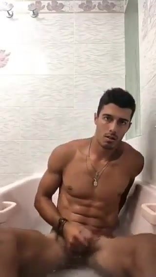 Gorgeous uncut muscle hunk wanks and cums in the bath