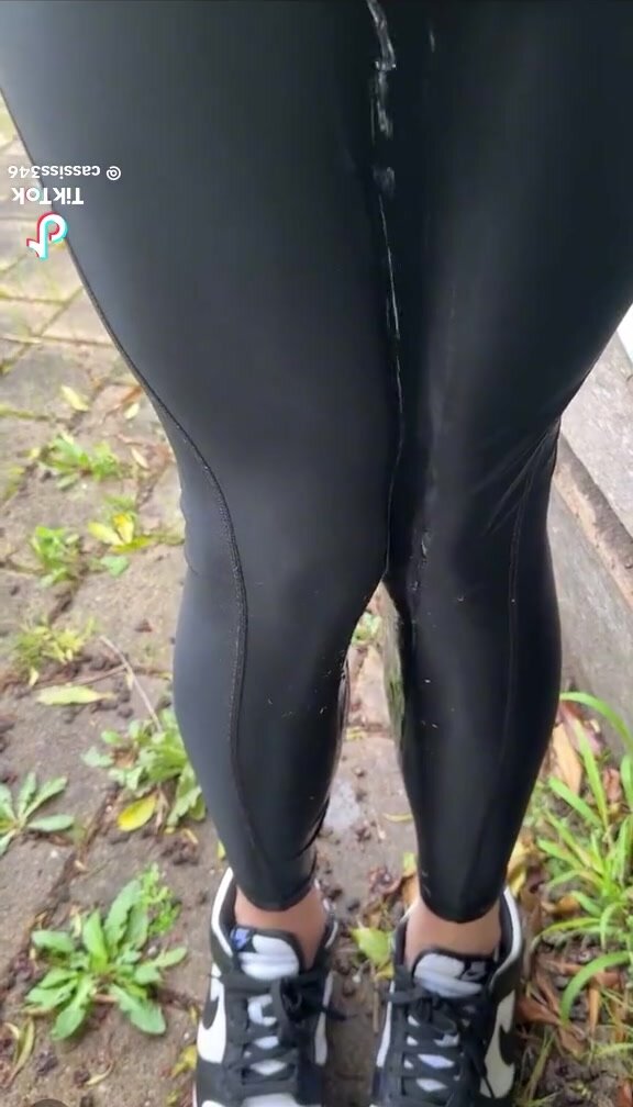 girl pees leggings outside