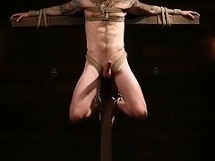 Christian Wilde tormented on a Cross