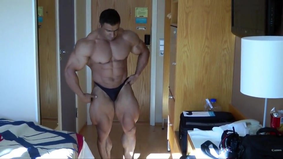 Arab ... flexing.  Awesome quads and abs