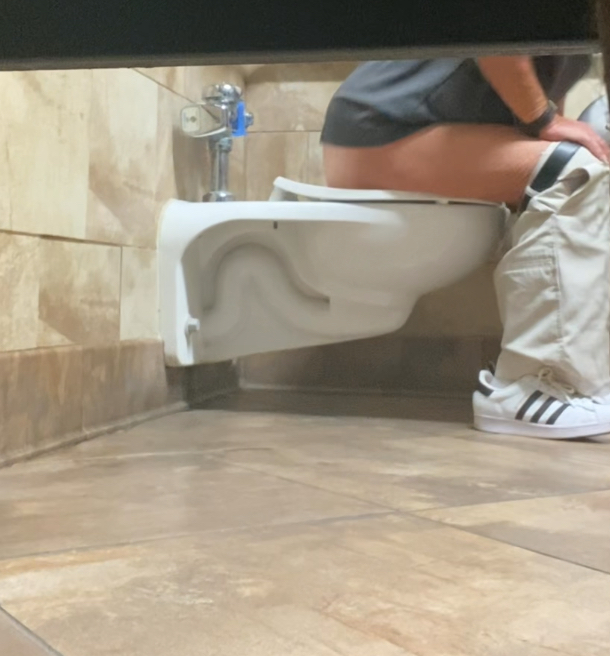 Old guy shitting while talking on the phone