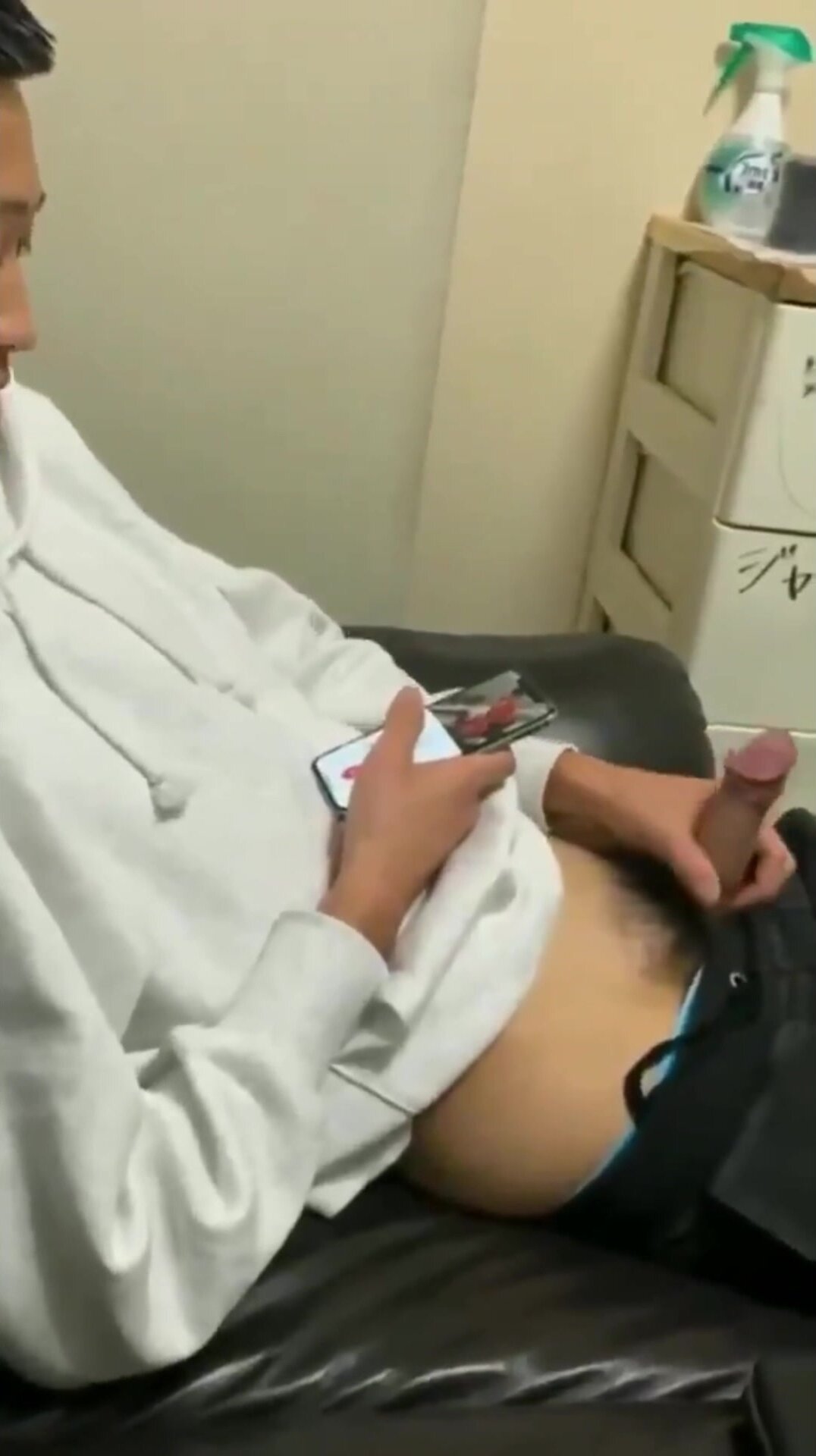 Japanese guy plays with his cock