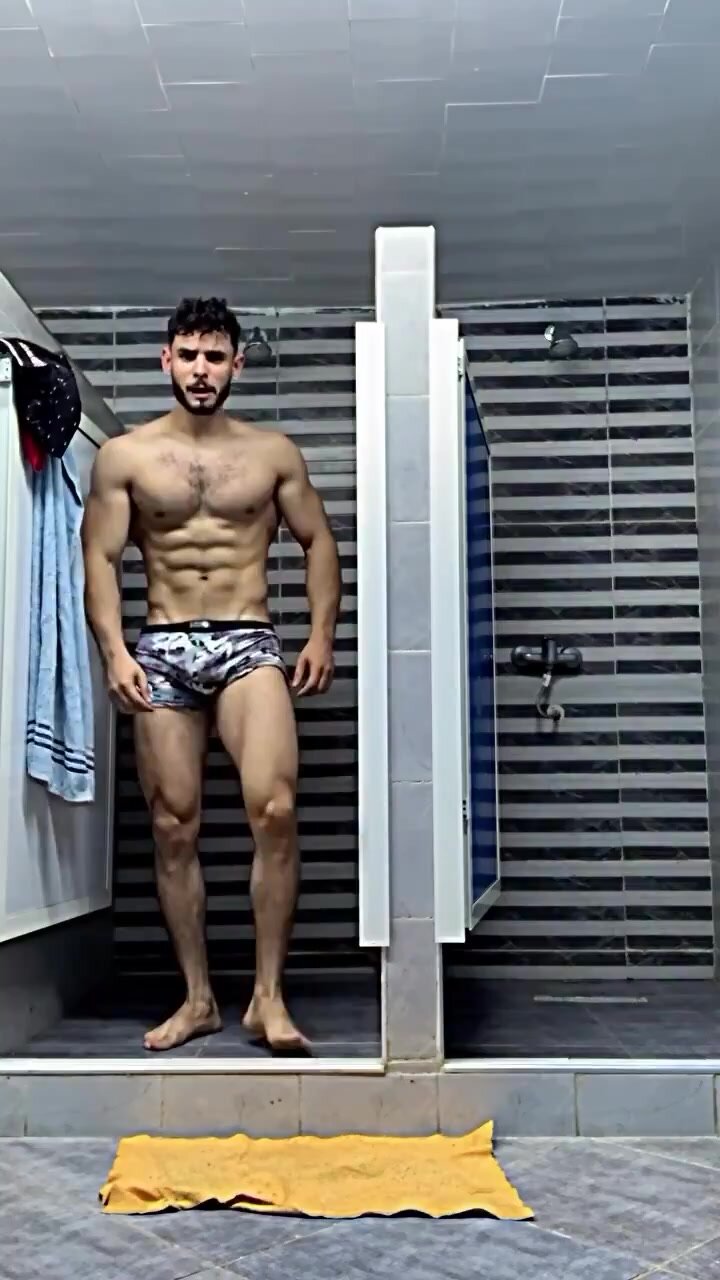 arab muscle possing with boxer